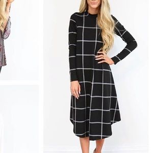 Shop Stevie black checkered high neck dress. Large